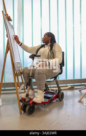 Disabled woman drawing at art classes Stock Photo