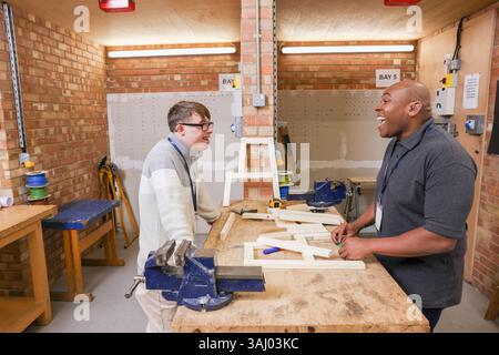 Disabled men working in workshop Stock Photo