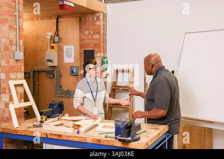 Disabled men working in workshop Stock Photo