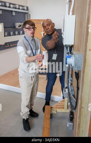 Disabled men working in workshop Stock Photo