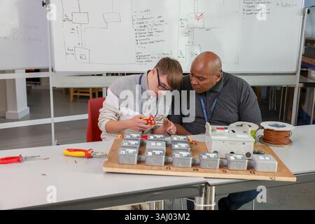 Disabled men working in workshop Stock Photo