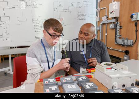 Disabled men working in workshop Stock Photo