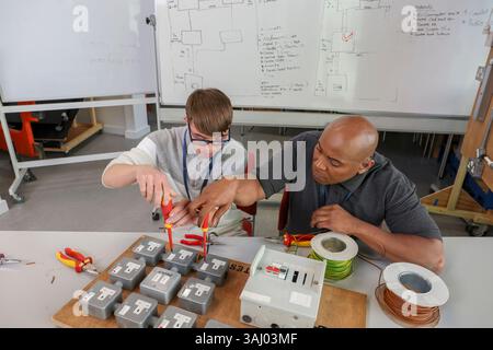 Disabled men working in workshop Stock Photo