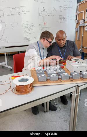 Disabled men working in workshop Stock Photo