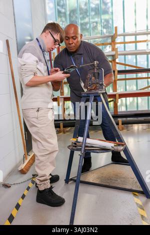 Disabled men working in workshop Stock Photo