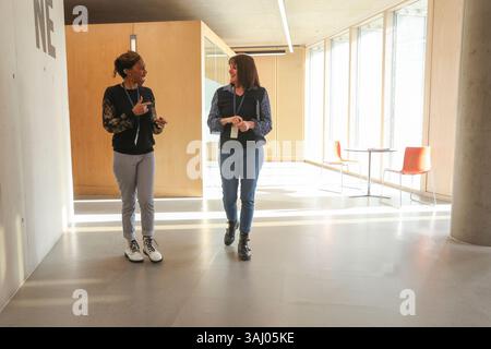 Coworkers using sign language in office Stock Photo
