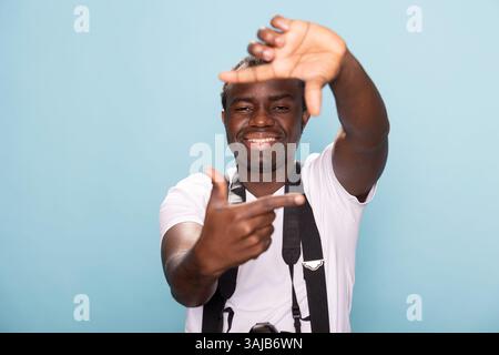 Happy man making rectangle shape with fingers Stock Photo - Alamy