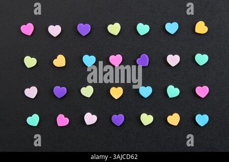 Rainbow-colored hearts arranged in a row Stock Photo