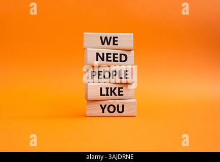 Hiring symbol. Wooden blocks with words We need People like You. Beautiful orange background. Business and Hiring concept. Copy space. Stock Photo
