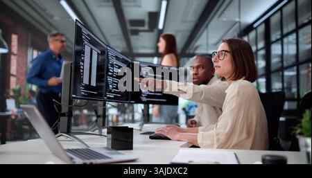 Creating Interactive Websites, Young Web Developer Codes On Computer Screen. Stock Photo