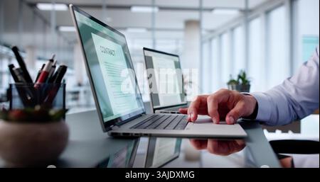 Reading Lease Agreement Contract Document On Laptop Computer Stock Photo