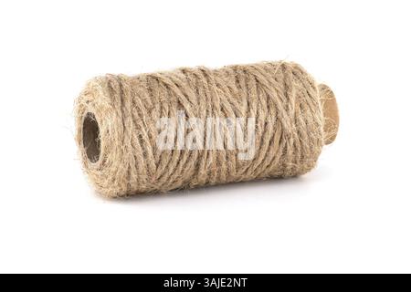 A roll of natural twine, perfect for crafts, gardening, or tying up packages. The twine is made of natural fibers and appears clean on a white backgro Stock Photo