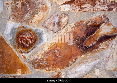 Textured Stone Wall Background, Irregularly shaped stones Stock Photo