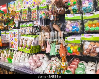 Cologne, Germany - March 22, 2022 - Store display of Easter decorations including bunny figurines and eggs. The display is colorful and festive, with Stock Photo