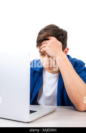 Sad and Tired Young Man with Laptop Isolated on the White Background Stock Photo