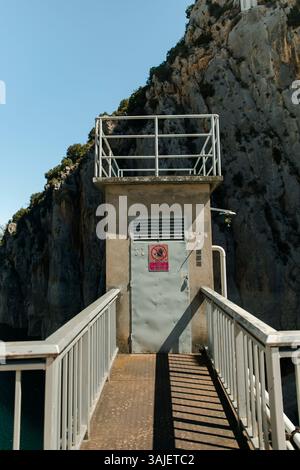 Restricted Access Control Building on Dam Walkway Stock Photo