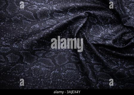 top view of black fake snakeskin. Vegan leather texture Stock Photo