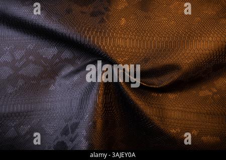 top view of black fake snakeskin. Vegan leather texture Stock Photo