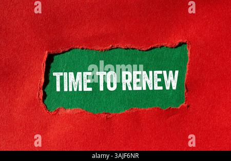 Time to renew message written on ripped torn red paper on green background. Conceptual time to renew symbol. Copy space. Stock Photo
