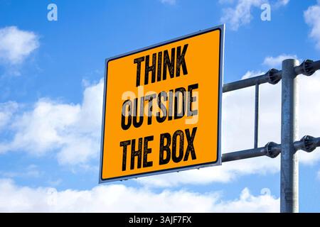 Think outside the box message written on billboard. Conceptual think outside the box symbol. Copy space. Stock Photo