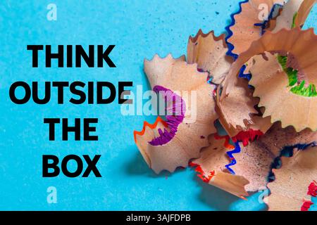 Think outside the box message written on blue background. Conceptual think outside the box symbol. Copy space. Stock Photo