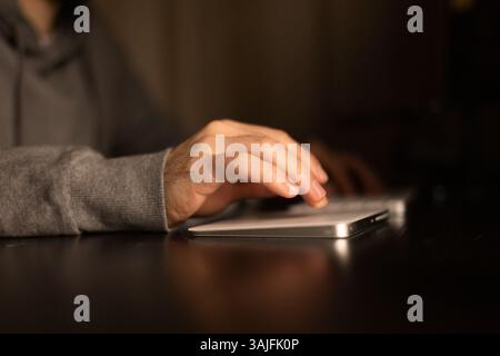 Desk and hands of a young programmer Stock Photo