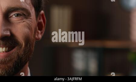 Close up facial portrait cropped view European half face serious business man change emotions smiling healthy toothy smile adult businessman male Stock Photo
