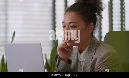 African American thoughtful upset thinking girl ethnic woman female businesswoman business worker employer office manager executive in office sad Stock Photo