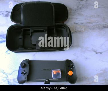 Mozyr, Belarus, March 16 2024: Nintendo Switch Game Console Controller with Black Case Top View. Stock Photo