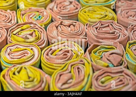 cotton multi-colored small napkins towels rolled up Stock Photo