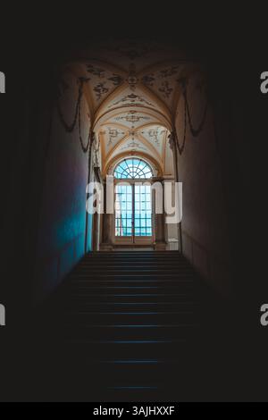Ancient dark staircase - Grunge interior, nobody, empty building architecture, window Stock Photo