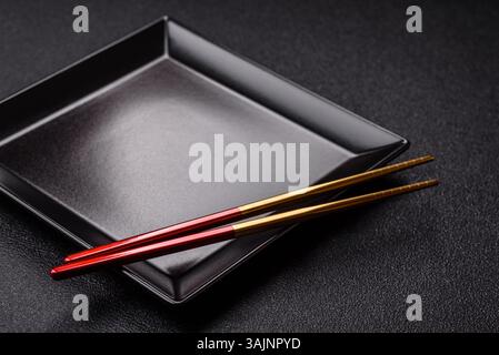 An empty plate with chopsticks for Japanese or Chinese food. Kitchen empty plate for Asian food Stock Photo