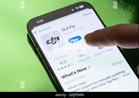 New York, USA - March 30, 2025: Opening DJI Fly app on smartphone screen close up view Stock Photo