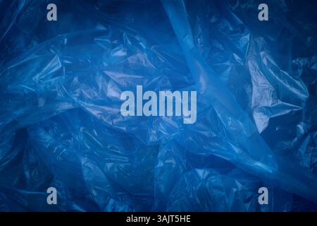 Blue crumpled plastic wrap. Close up. Stock Photo