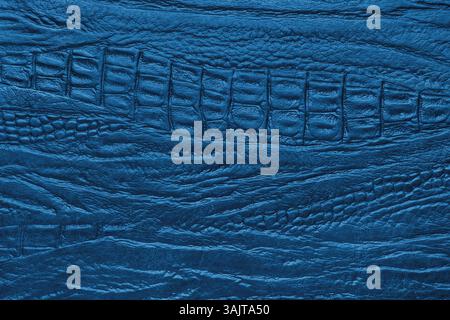 Crocodile genuine leather structure texture macro, blue colored leatherette surface with metallic, pearlescent effect. Reptile skin close up, macro ba Stock Photo