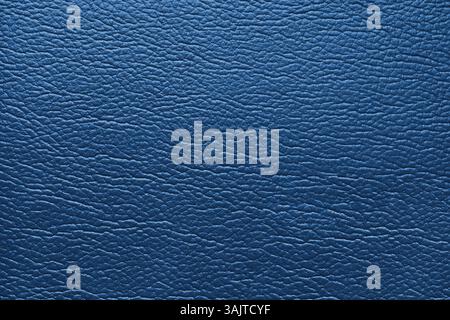 Glossy structure of genuine leather, natural skin surface with embossing pattern. Artifical blue colored  leatharette close up, macro texture. Backgro Stock Photo