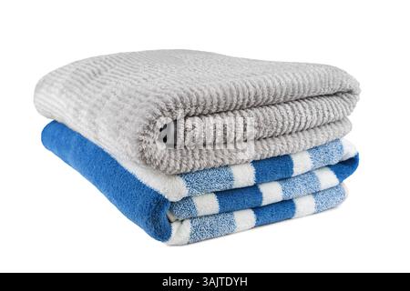 Soft fluffy striped grey and blue bath towels folded in stack isolated on white background. Terry cloth, striped pattern towel texture, cotton bath te Stock Photo