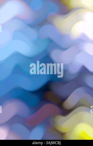 Soft abstract background with wavy lines in blue and yellow gradient, creating a dreamy blurred effect. Stock Photo