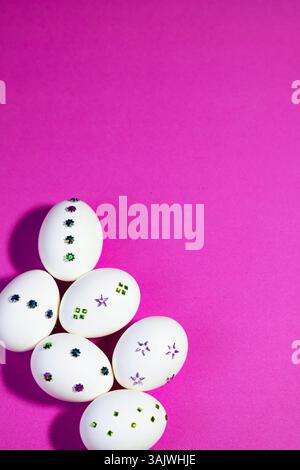 Flat Lay with Decorative White Eggs On light Purple Backkground. Modern festive design with handcrafted egg decorations in a flat layout, perfect for Stock Photo