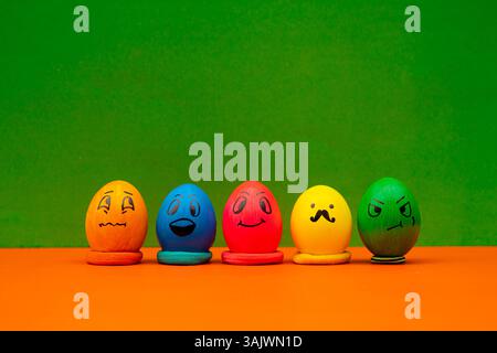 Colorful Easter Eggs Showing Happy And Funny Faces. Cute and creative Easter egg faces that bring humor and charm to springtime photos. Stock Photo