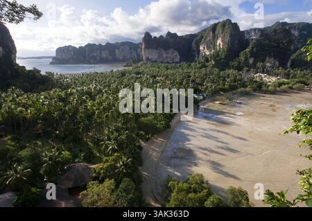 August 22, 2009 - Thailand - Panoramic view of Railay near Krabi in Thailand from the viewing point. Railay, also known as Rai Leh, is a small peninsula between the city of Krabi and Ao Nang in Thailand. It is accessible only by boat due to high limestone cliffs cutting off mainland access. These cliffs attract rock climbers from all over the world, but the area is also popular due to its beautiful beaches and quiet relaxing atmosphere. Accommodation ranges from bungalows and medium-priced resorts in East Railay to a collection of five-star resorts focused on West Railay though one, Rajavadee, Stock Photo