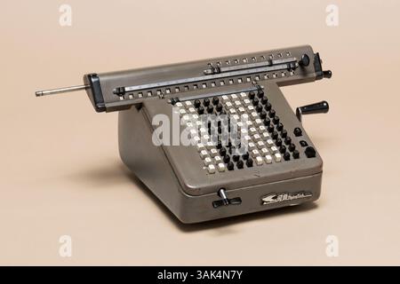 Pavia, Lombardy, Italy - November 2, 2024: Flying Fish Chinese-made mechanical calculator likely from the 1950s or 1960s  before the advent of electro Stock Photo