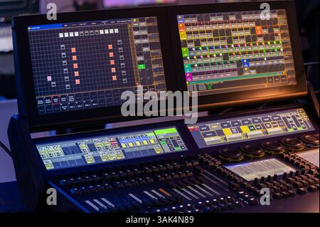 Modern digital mixing console for controlling stage lighting during entertainment events Stock Photo