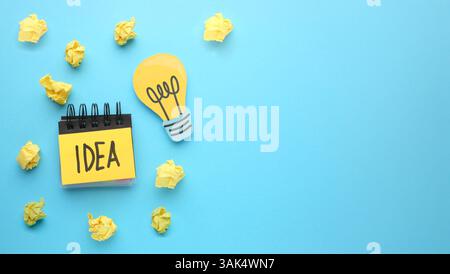 Creative thinking ideas and innovation concepts. Yellow coloured light bulb on the background. High quality photo Stock Photo