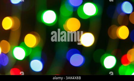 Bright Multicolored Bokeh Circles in Defocused Abstract Background, Vibrant Festive Lights Stock Photo