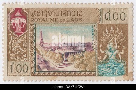 LAOS - 1958, November 3: 1 kip olive-bister, claret and greenish-blue postage stamp depicting UNESCO building, Eiffel tower, Globe and Goddess. UNESCO Headquarters in Paris opening. Laos is a Republic In northwestern Indo China, capital Vientiane. Before 1949, Laos was part of the French colony of Indo-China and used its stamps until 1951. The kingdom was replaced by the Lao Peoples Democratic Republic Dec. 2, 1975 Stock Photo