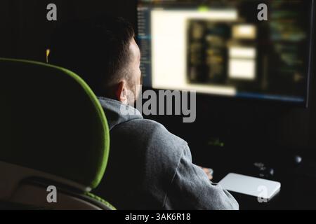 Programmer codes from home. Remote work Stock Photo