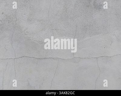 Texture of a white painted concrete plaster wall surface: detailed, rough and versatile for architectural, interior design and artistic applications Stock Photo