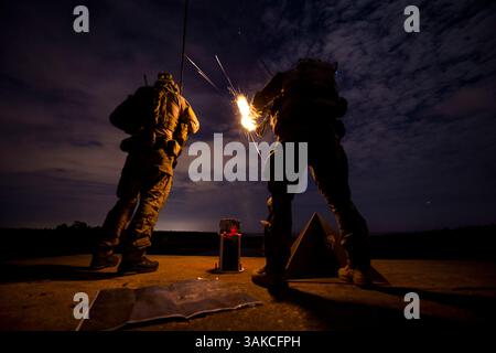 Mar 4, 2017 - Hurlburt Field, Florida, United States - A U.S. Air Force Airman assigned to the 22nd Special Tactics Squadron fires his rifle during Emerald Warrior 17 at Eglin Range, Fla., March 4, 2017. Emerald Warrior is a U.S. Special Operations Command exercise during which joint special operations forces train to respond to various threats across the spectrum of conflict. 1st Combat Camera Squadron (Credit Image: © Paul Labbe/U.S. Air Force /DOD/ZUMAPRESS.com) Stock Photo