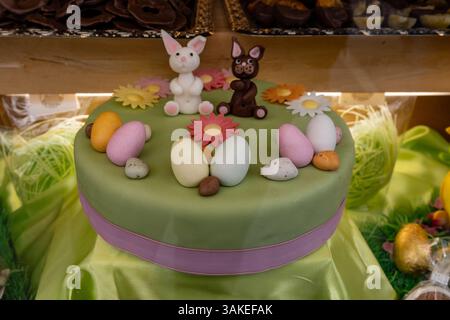 Various Easter-themed confectionery, marmalade chickens, chocolates and eggs, on display counter in old traditional candy shop in Vienna, Austria, clo Stock Photo